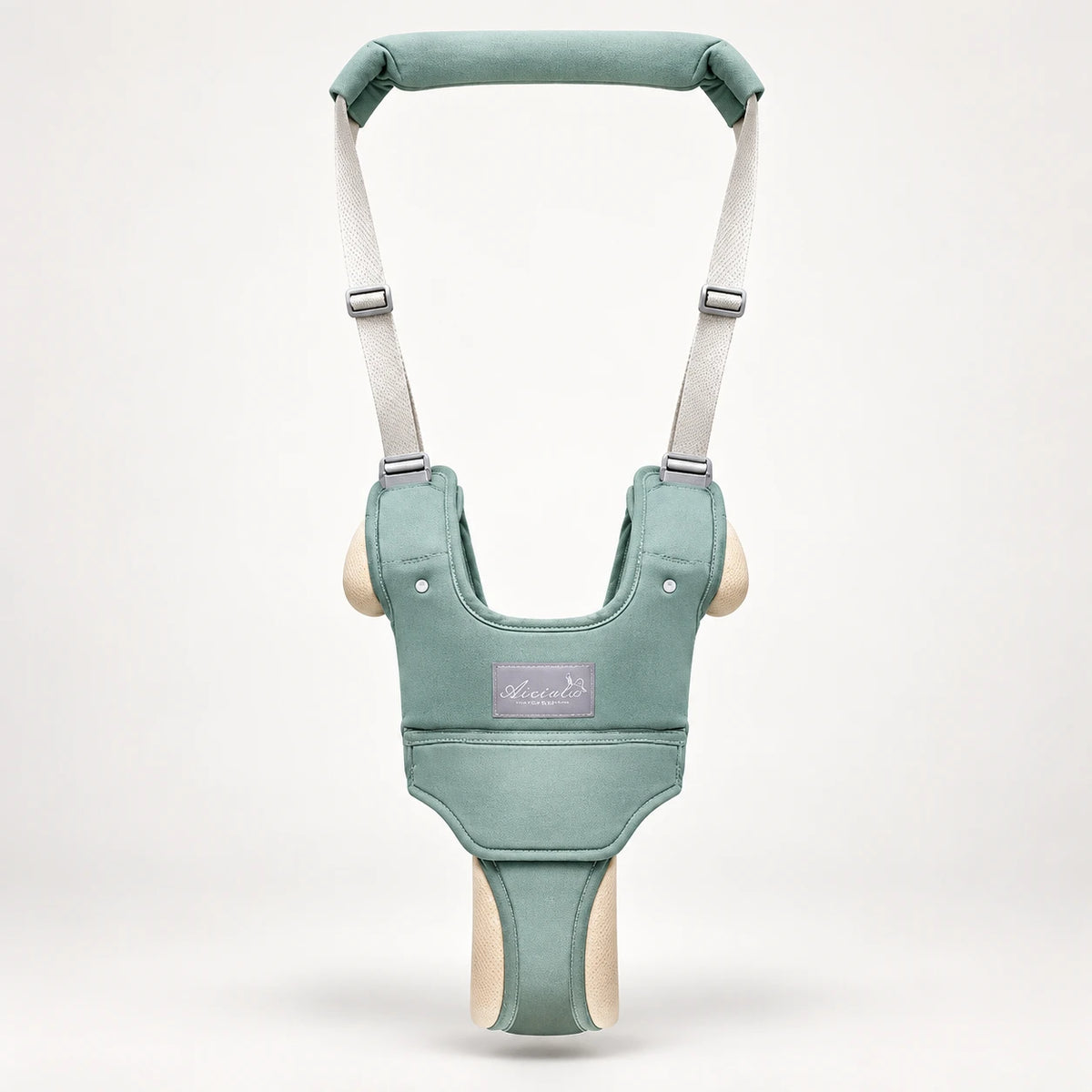 Front view of the green baby walking harness with padded handle and adjustable straps
